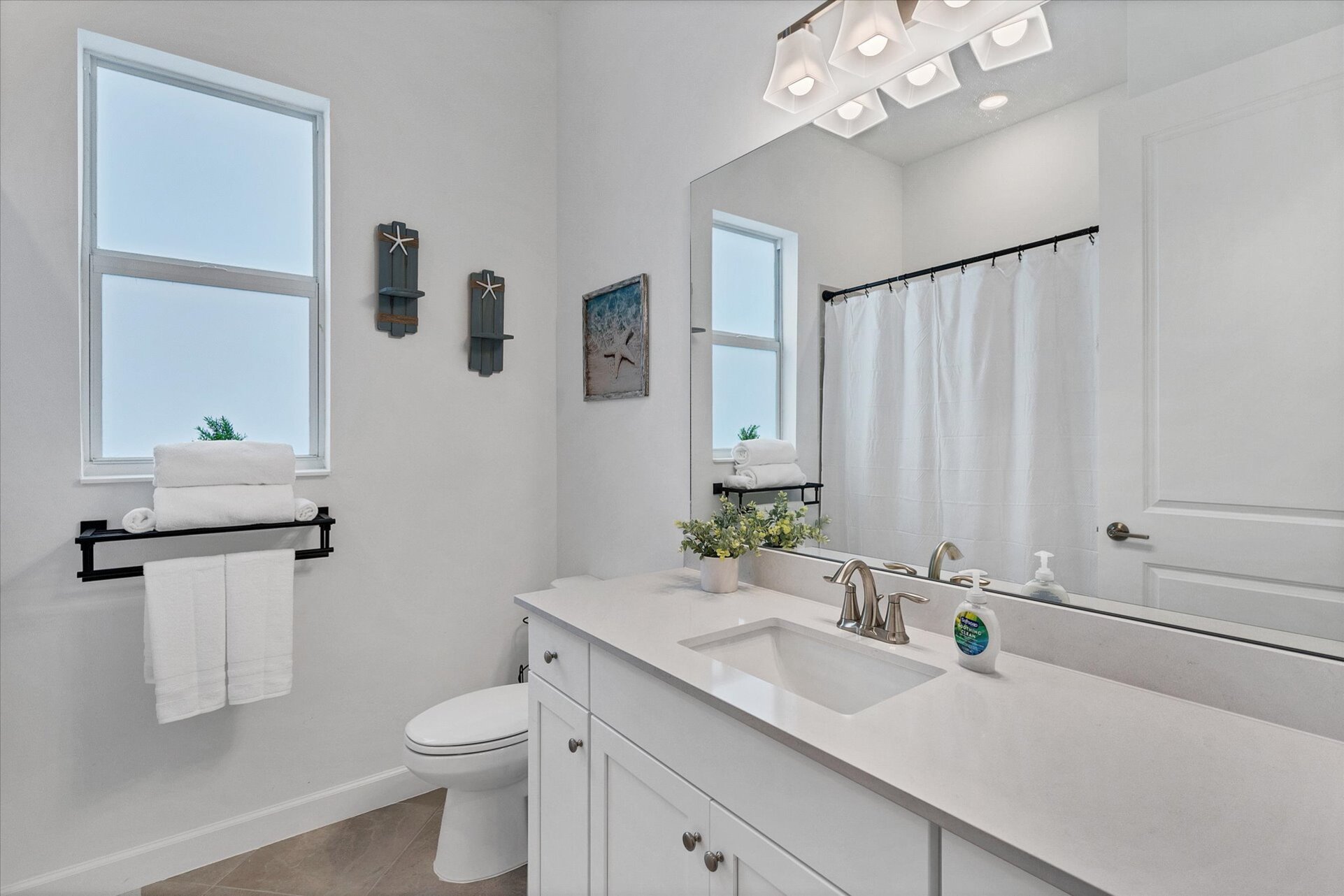 Shared bathroom with shower/tub combo