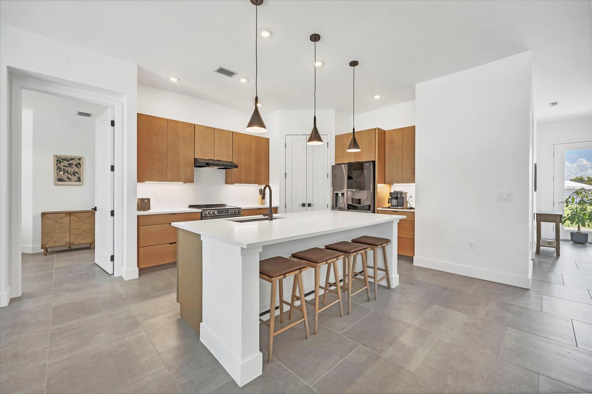 Beautiful, fully-equipped kitchen with brand new appliances. Kitchen island seats 4