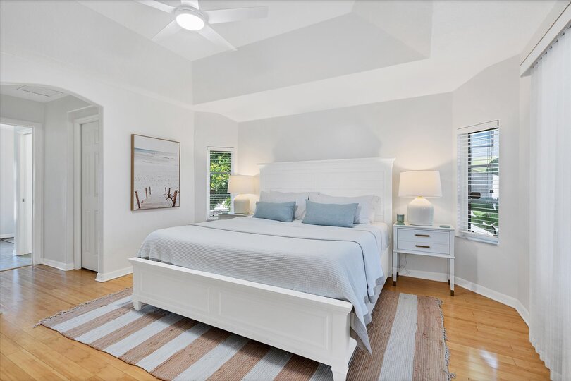Primary Bedroom with king bed, lanai access, ensuite and 50-inch Smart TV