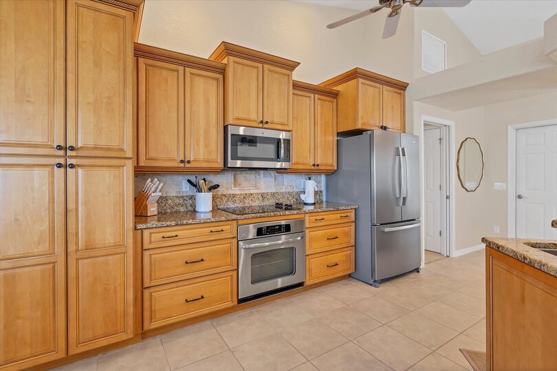 Fully-equipped kitchen over looking the living room and dining area