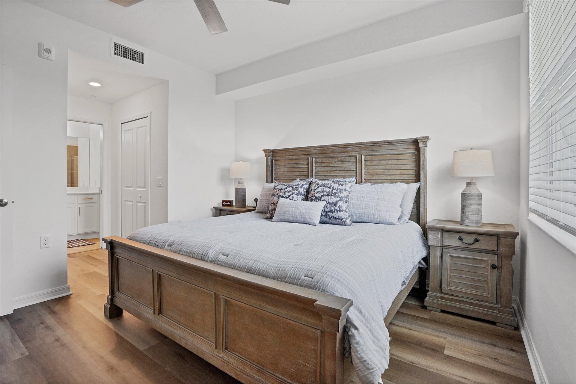 Primary bedroom with king bed, attached bathroom and 43-inch Smart TV
