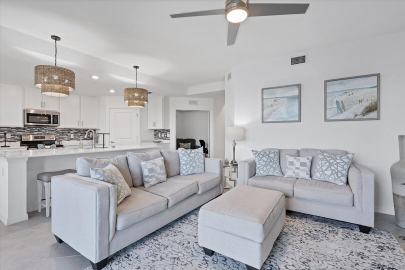 Beautiful living room featuring ample seating and 65-inch Smart TV with HD antenna
