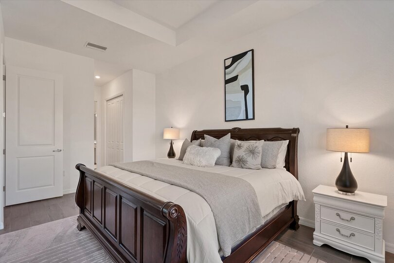 Primary bedroom with king bed, lanai access and ensuite