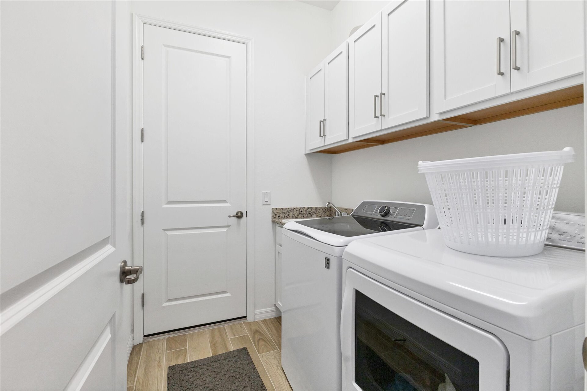 Laundry room with full-size washer & dryer and garage access