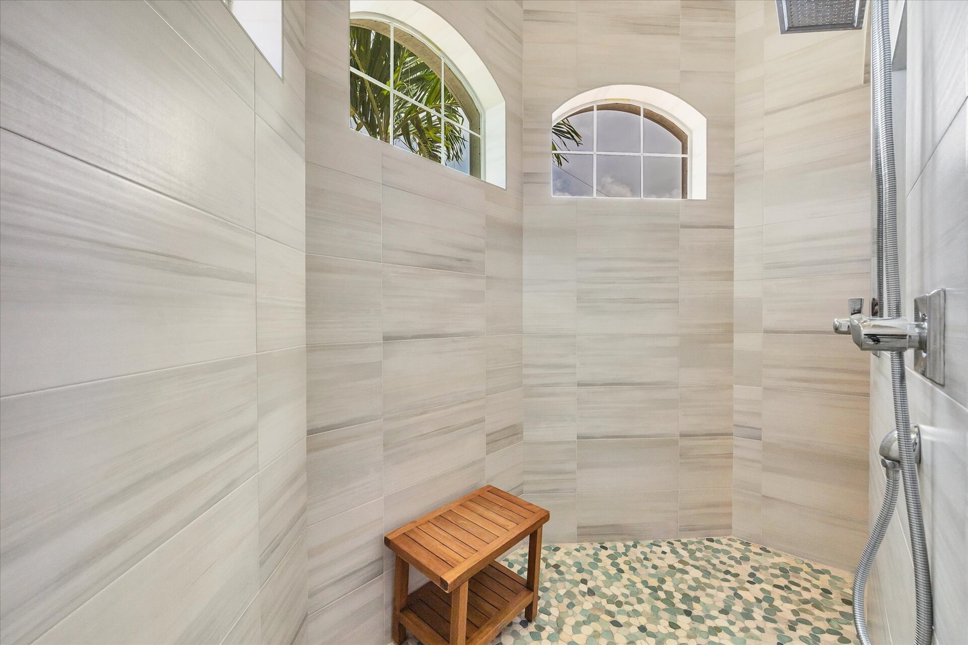 Beautiful primary en suite with large walk-in shower and double vanities