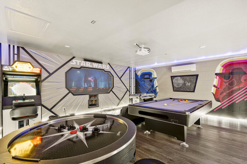 This fun game room features tons of custom artwork
