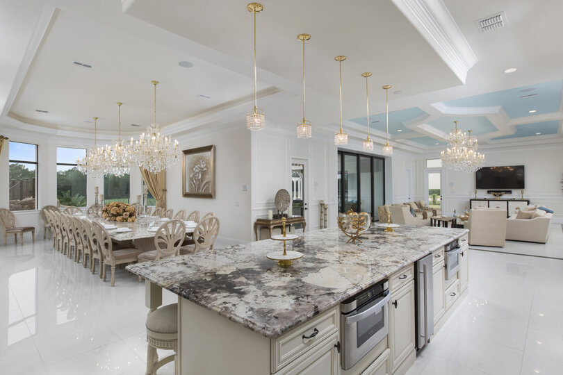 The fully equipped kitchen flows between the living area and dining room