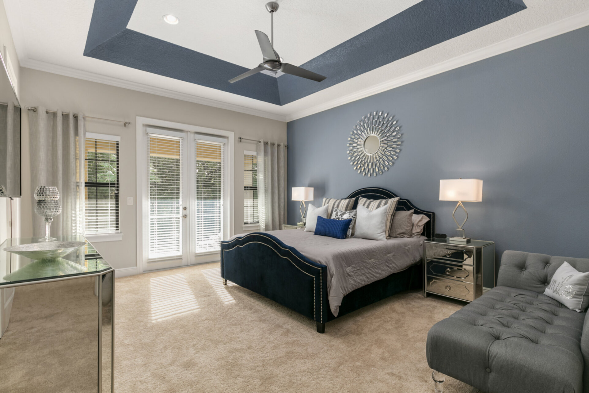This master bedroom is spacious and has easy balcony access