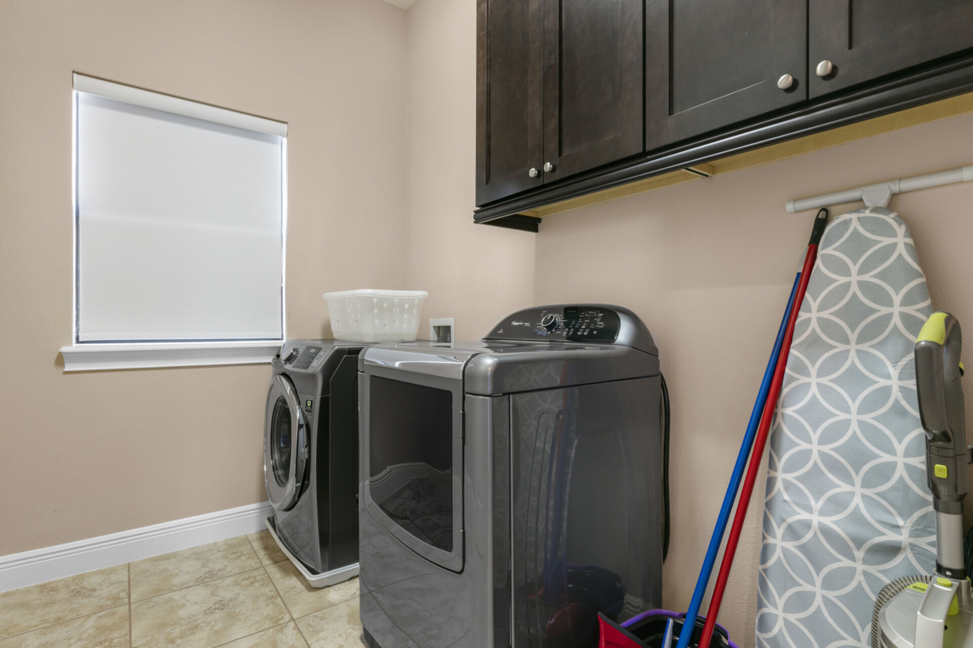 The laundry room has a washer and dryer