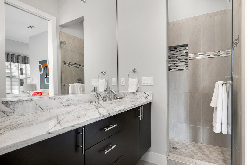 En-suite bathroom 2 has marble vanity and glass door walk-in shower