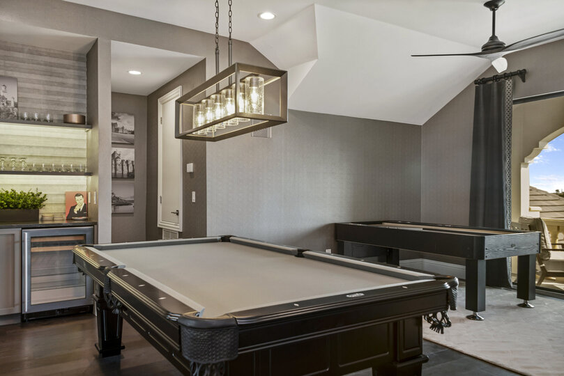 Both a billiards and shuffleboard table are located in the third floor lounge