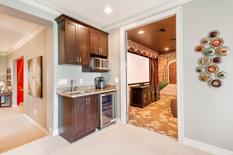 Head upstairs were entertainment awaits. The wet bar is located in the game room next to the theater room