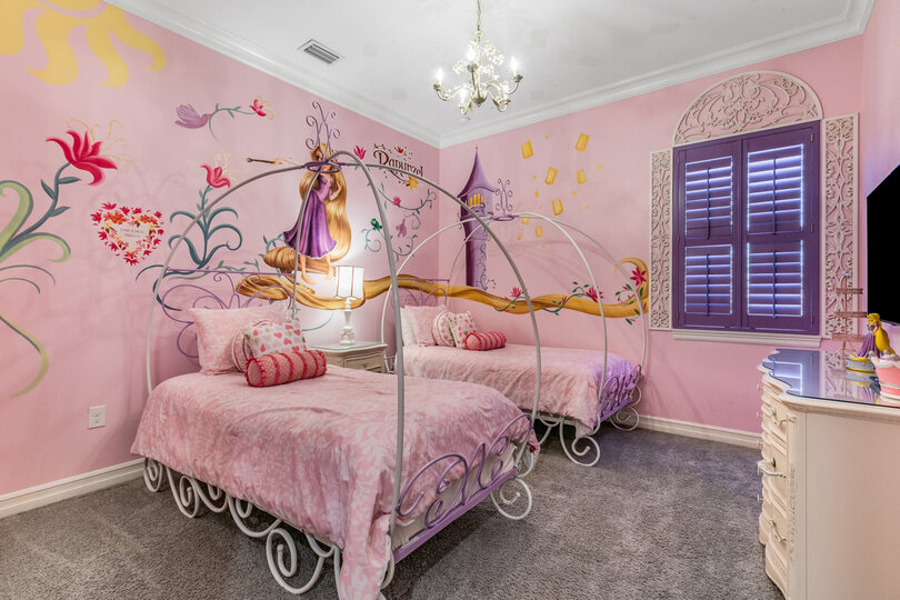 The princesses will love their custom bedroom with two twin beds