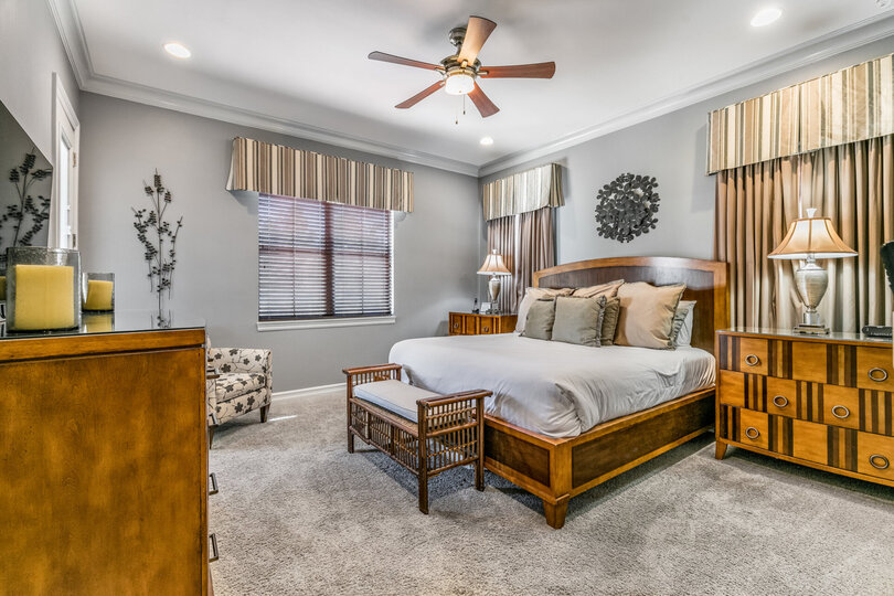 Master Suite 2 features a 50-inch TV and balcony access all located on the second floor
