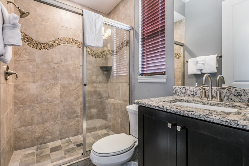 En-suite bathroom with glass door shower