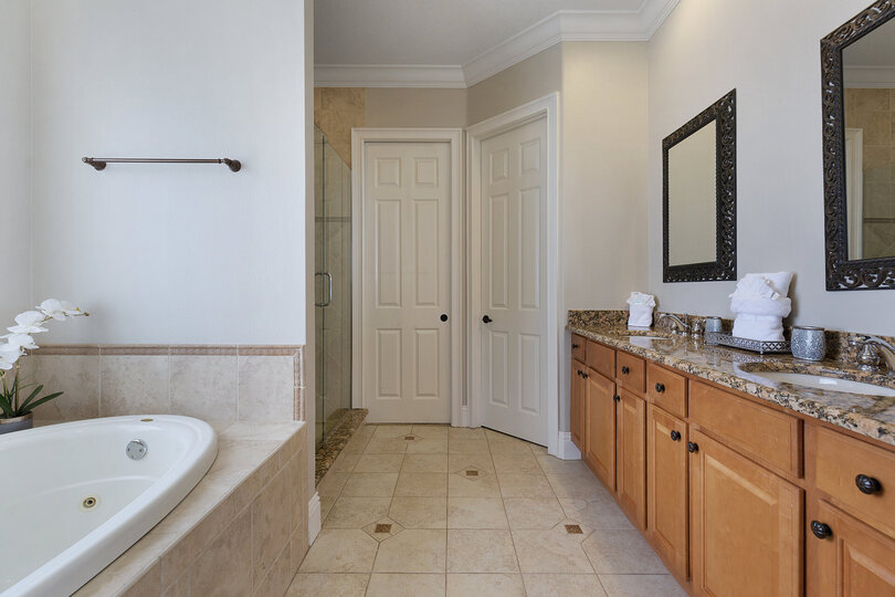 Ensuite bathroom with garden tub, walk-in shower and separate water closet