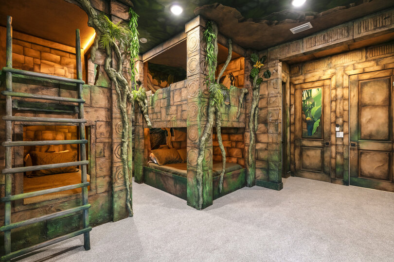 Custom-built bunkbeds will make the kids feel like they're sleeping in the middle of a jungle