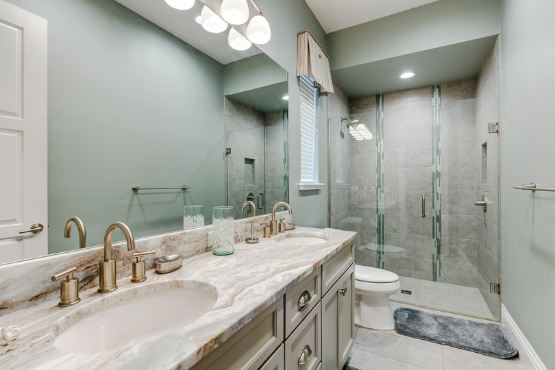 The ensuite bathroom has a walk-in shower