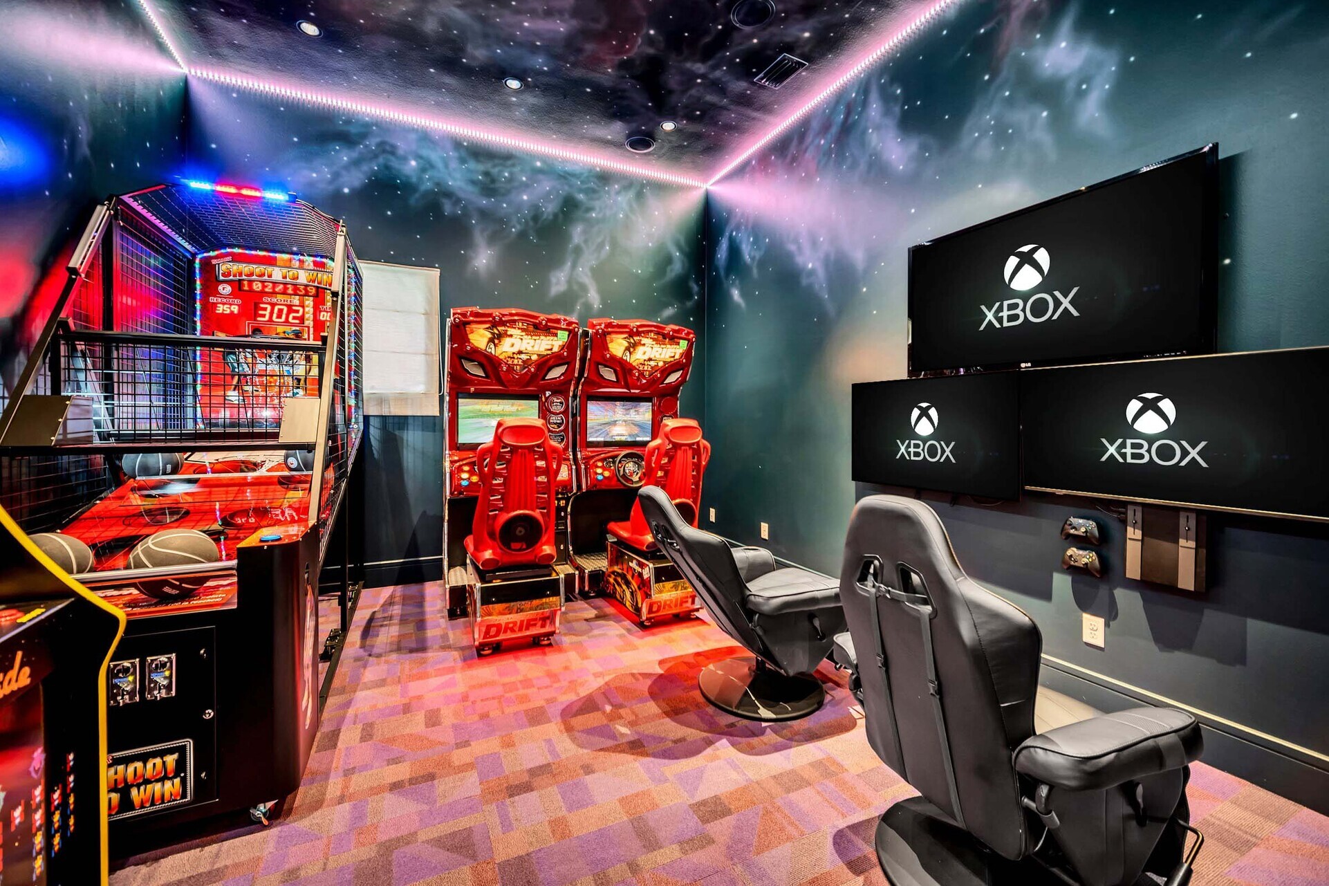 The galaxy-themed game room offers Fast and Furious Drift side-by-side racers, Shoot to Win basketball, a multi-arcade game, and Xbox with 3 Smart TV's and gaming chairs