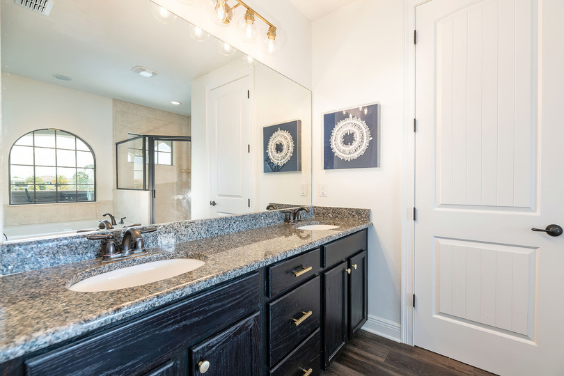 The en suite bathroom includes a spacious double vanity