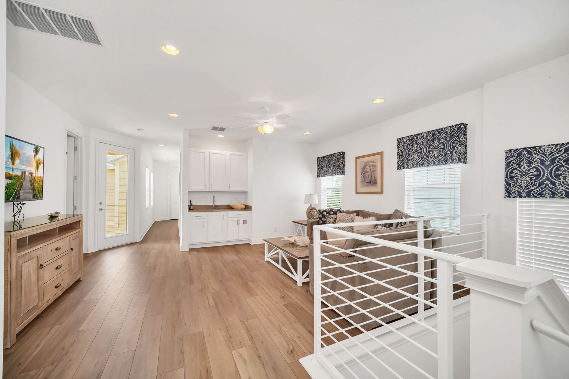 Gather in the 2nd floor loft area, a versatile space perfect for lounging, watching movies, or enjoying casual conversations.