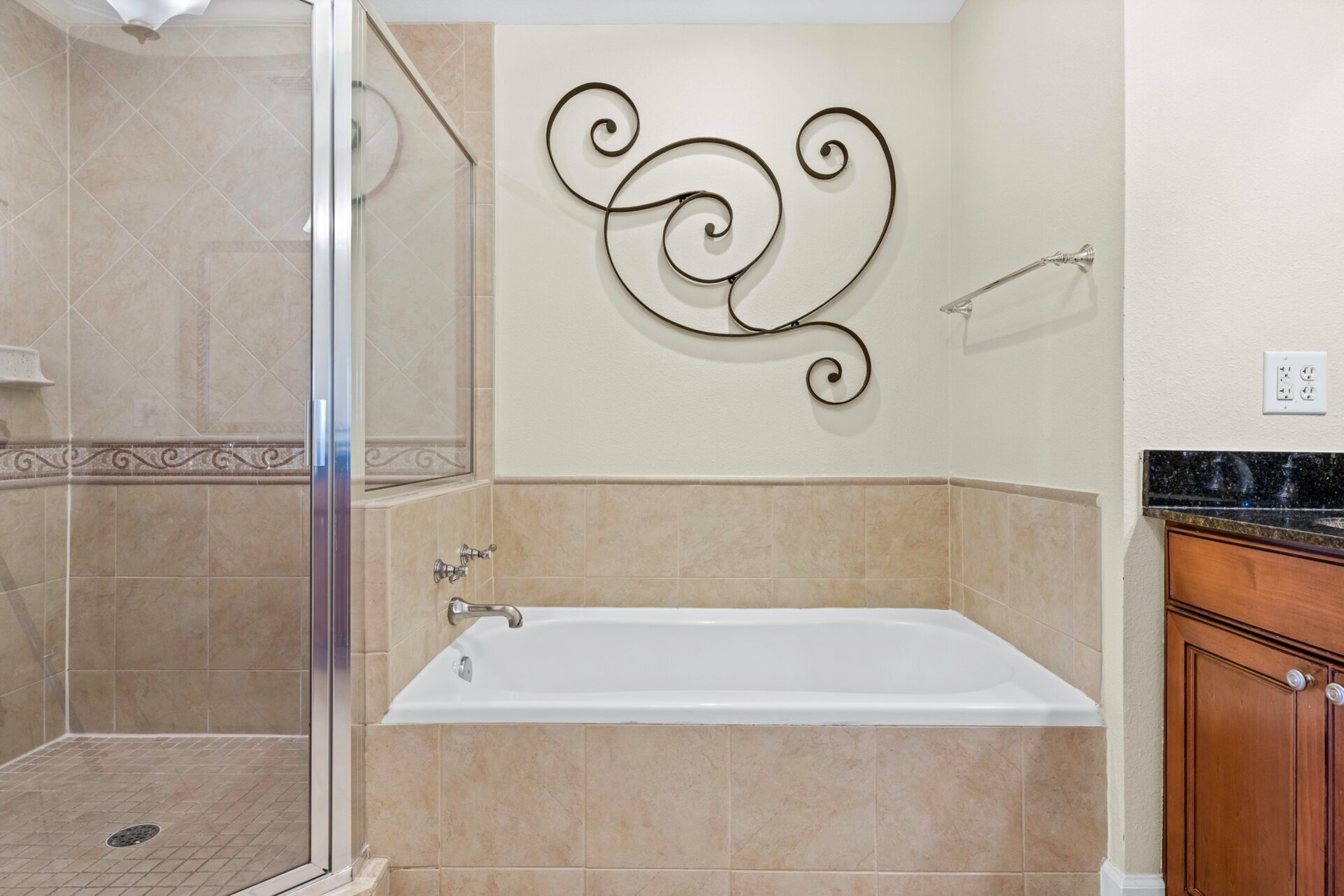 Relax in the inviting bathtub, providing a peaceful escape for a soothing soak after a long day
