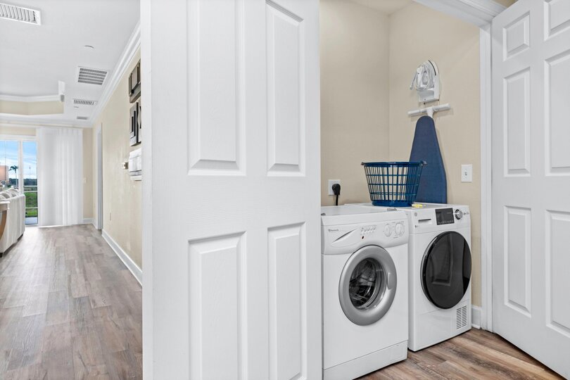 The ground floor laundry room has a set of washer and dryer
