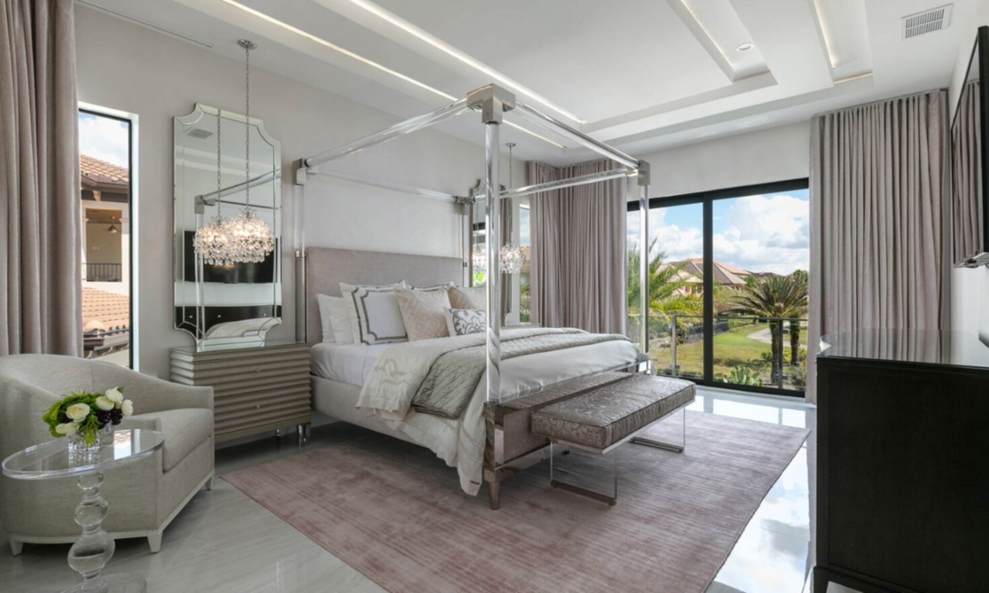 Master Bedroom 3 with Acrylic Canopy King Bed, 60 inch TV, and sitting area