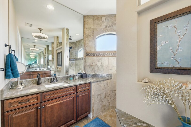 Primary en suite with large walk-in shower and double vanities