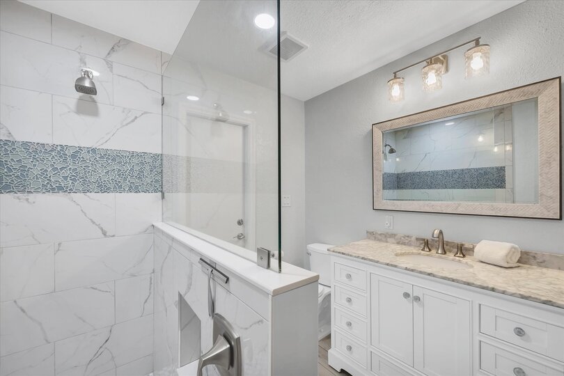 Guest bathroom featuring large walk-in shower