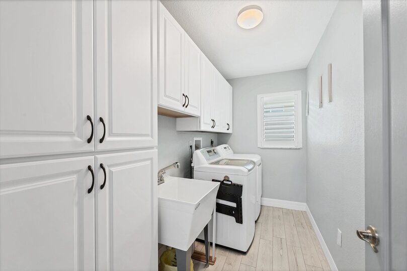 Laundry room with full-size washer and dryer