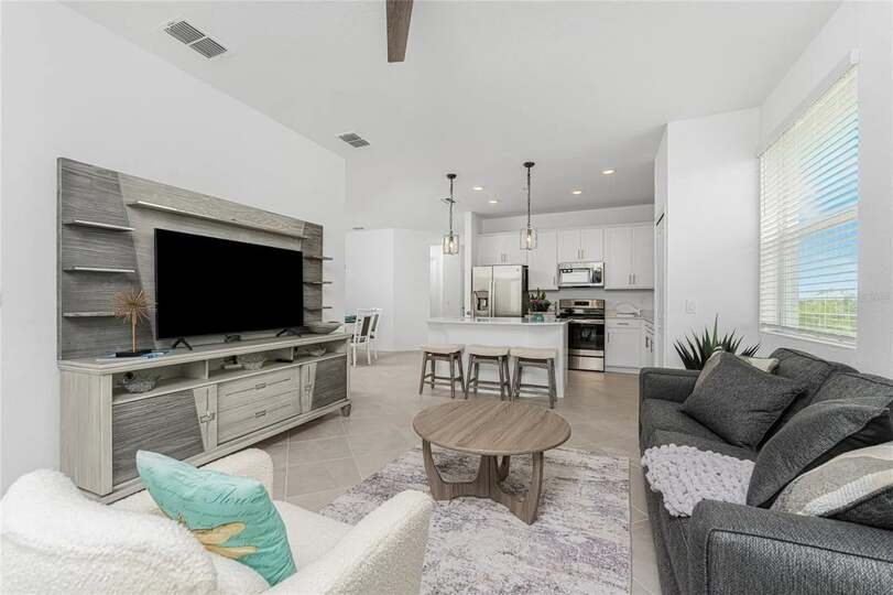 Living room with comfy seating and 55-inch Smart TV