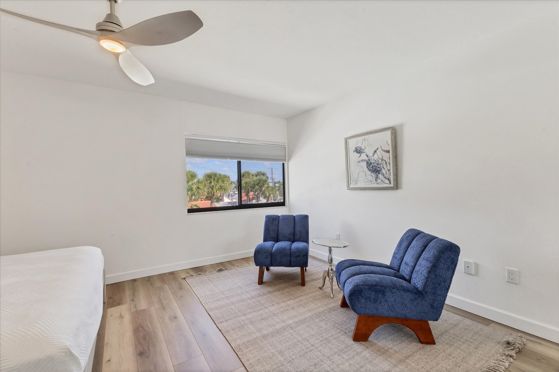 King bedroom with attached bathroom and view of bay