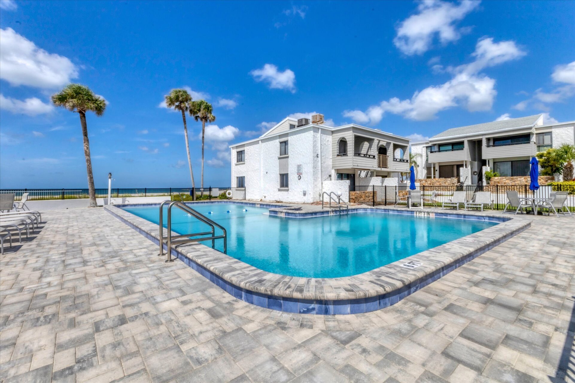 Large community pool overlooking Venice Beach and the Gulf